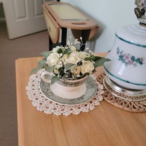 Vintage teacup and saucer with faux whi and Green Faux Floral Arrangement Accent